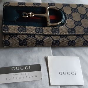 Used authentic vintage Gucci long wallet tri-folds